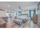 Relaxing bedroom with a king-size bed and wood floors at 3980 River Rd, Johns Island, SC 29455
