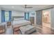Comfortable bedroom with king bed and barn door to bathroom at 3980 River Rd, Johns Island, SC 29455