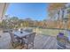 Deck with table and chairs, overlooking backyard at 3980 River Rd, Johns Island, SC 29455