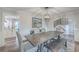 Bright dining room with hardwood floors and kitchen view at 3980 River Rd, Johns Island, SC 29455