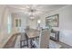 Elegant dining room with a large table and chandelier at 3980 River Rd, Johns Island, SC 29455