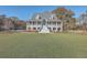 Two story home with wrap around porch and spacious yard at 3980 River Rd, Johns Island, SC 29455