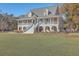 Two story home with wrap around porch and spacious yard at 3980 River Rd, Johns Island, SC 29455