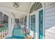 Charming front porch features rocking chairs and a teal floor at 3980 River Rd, Johns Island, SC 29455