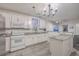 Modern kitchen featuring white cabinets, granite countertops, and stainless steel appliances at 3980 River Rd, Johns Island, SC 29455