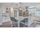 White kitchen with marble island and stainless steel appliances at 3980 River Rd, Johns Island, SC 29455