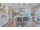 Modern kitchen with white cabinets, large island, and stainless steel appliances at 3980 River Rd, Johns Island, SC 29455