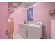 Laundry room with washer, dryer, and additional shelving for storage at 3980 River Rd, Johns Island, SC 29455