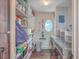 Convenient laundry room with shelving and washer/dryer at 3980 River Rd, Johns Island, SC 29455