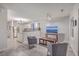 Cozy living room with two gray armchairs, a coffee table, and a large flat-screen TV at 3980 River Rd, Johns Island, SC 29455