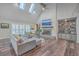 Spacious living room with vaulted ceiling, fireplace, and built-in shelving at 3980 River Rd, Johns Island, SC 29455