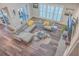Open living area with gray sectional and hardwood floors at 3980 River Rd, Johns Island, SC 29455