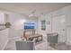 Comfortable living area with gray armchairs, a coffee table, and a large TV at 3980 River Rd, Johns Island, SC 29455