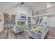 Two-story living room with gray sectional sofa and fireplace at 3980 River Rd, Johns Island, SC 29455