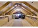 Unfinished attic space with wooden beams and flooring at 455 Switchgrass Dr, Summerville, SC 29486
