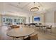 Bright community room with multiple tables and chairs at 455 Switchgrass Dr, Summerville, SC 29486