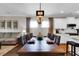 Dining room with a rustic wooden table and chandelier at 455 Switchgrass Dr, Summerville, SC 29486