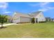 Gray siding house with a large backyard and landscaping at 455 Switchgrass Dr, Summerville, SC 29486