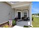 Charming front porch with potted plants and a welcoming atmosphere at 455 Switchgrass Dr, Summerville, SC 29486