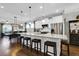 Open concept kitchen boasts a large island, stainless steel appliances, and white cabinetry at 455 Switchgrass Dr, Summerville, SC 29486