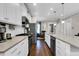 Modern kitchen with white cabinets, stainless steel appliances, and large island at 455 Switchgrass Dr, Summerville, SC 29486