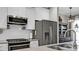 Modern kitchen features stainless steel appliances and white cabinetry at 455 Switchgrass Dr, Summerville, SC 29486