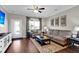 Living room with hardwood floors, comfortable seating, and a ceiling fan at 455 Switchgrass Dr, Summerville, SC 29486