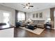 Living room with hardwood floors, comfortable seating, and a ceiling fan at 455 Switchgrass Dr, Summerville, SC 29486