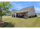 Covered patio with seating area and grill at 455 Switchgrass Dr, Summerville, SC 29486