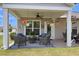 Covered patio with wicker furniture and potted plants at 455 Switchgrass Dr, Summerville, SC 29486