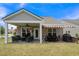 Patio with seating area, dining table, and grill at 455 Switchgrass Dr, Summerville, SC 29486
