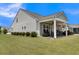 Covered patio with seating area and grill at 455 Switchgrass Dr, Summerville, SC 29486