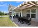 Covered patio with seating and dining areas at 455 Switchgrass Dr, Summerville, SC 29486