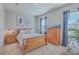 Bright bedroom with wood furniture and blue accents at 459 Spring Hollow Dr, Charleston, SC 29492