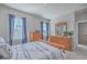 Charming bedroom with wood furniture and blue bedding at 459 Spring Hollow Dr, Charleston, SC 29492