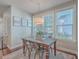 Charming dining area with wooden table and metal chairs, bathed in natural light at 459 Spring Hollow Dr, Charleston, SC 29492