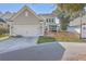 Rear view of house, showcasing garage and fenced patio at 459 Spring Hollow Dr, Charleston, SC 29492