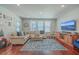 Spacious living room featuring hardwood floors and large windows at 459 Spring Hollow Dr, Charleston, SC 29492