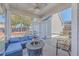 Relaxing screened porch with seating area, fire pit table, and view of backyard at 459 Spring Hollow Dr, Charleston, SC 29492