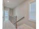 Elegant staircase with a wrought iron railing and carpeted steps at 459 Spring Hollow Dr, Charleston, SC 29492