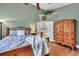 Serene bedroom with wood flooring, ceiling fan, and en-suite bathroom access at 469 Blue Dragonfly Dr, Charleston, SC 29414