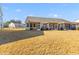Homes with screened porches and a shared grassy backyard at 5100 Park Creek Ave, North Charleston, SC 29418