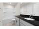 Clean bathroom featuring a shower/tub combo, gray vanity, and black countertop at 5100 Park Creek Ave, North Charleston, SC 29418