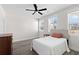 Bright bedroom with double bed, ceiling fan, and hardwood floors at 5100 Park Creek Ave, North Charleston, SC 29418