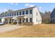 Two-story townhome with stone accents and a metal roof at 5100 Park Creek Ave, North Charleston, SC 29418
