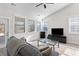 Sunlit living room with hardwood floors and access to backyard at 5100 Park Creek Ave, North Charleston, SC 29418