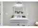 Vanity with white quartz countertop, black matte faucet, and framed mirror at 561 Saint Andrews Blvd, Charleston, SC 29407