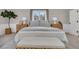 Relaxing bedroom with a striped comforter and wicker furniture at 561 Saint Andrews Blvd, Charleston, SC 29407