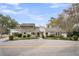 Two-story house with gray siding, landscaping, and a driveway at 561 Saint Andrews Blvd, Charleston, SC 29407