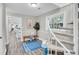 Hallway showcasing a spiral staircase and a view into the dining room at 561 Saint Andrews Blvd, Charleston, SC 29407